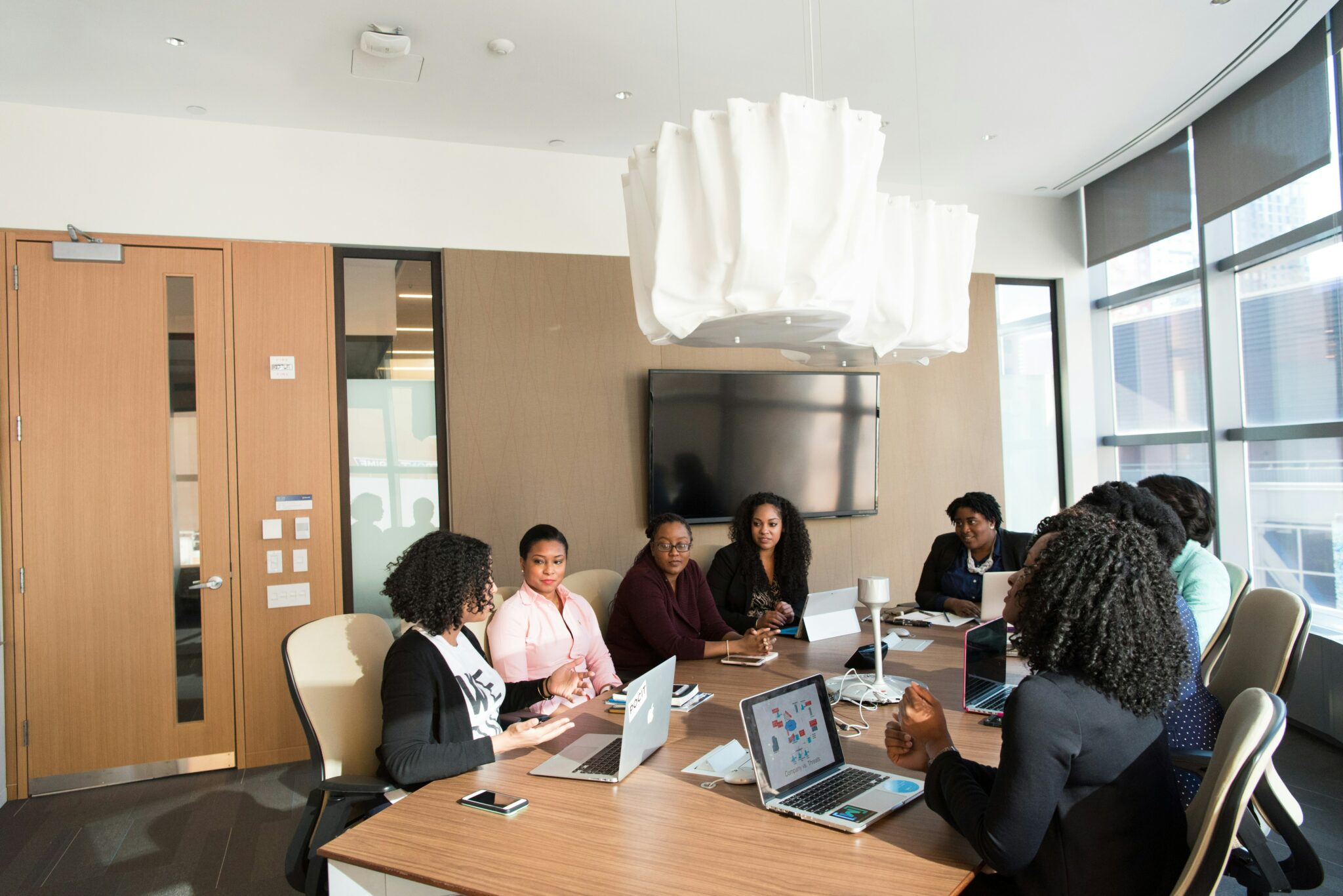 Colleagues discussing ideas together during a team meeting.